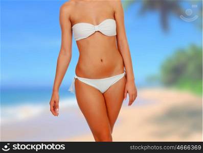 Attractive woman with white bikini in the beach