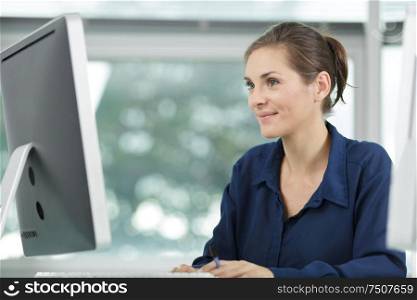attractive woman working at an office computer