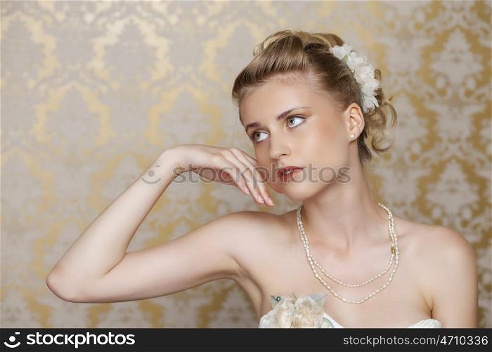 Attractive young blonde bride with beautiful wedding hairstyle