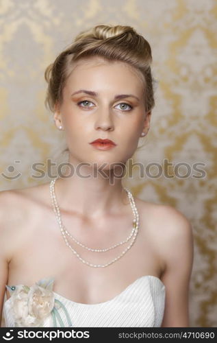 Attractive young blonde bride with beautiful wedding hairstyle