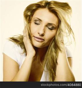 Attractive young blonde woman long hair portrait romantic girl closed eyes