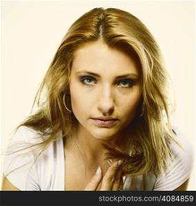 Attractive young blonde woman long hair portrait, studio shot