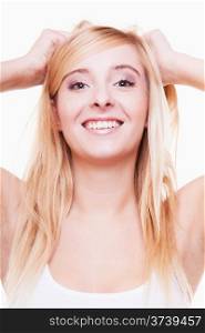 Attractive young blonde woman teen girl smiling pulling her hair portrait isolated on white background