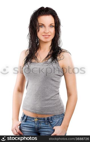 attractive young brunette in t-shirt and blue jeans looking in camera smiling