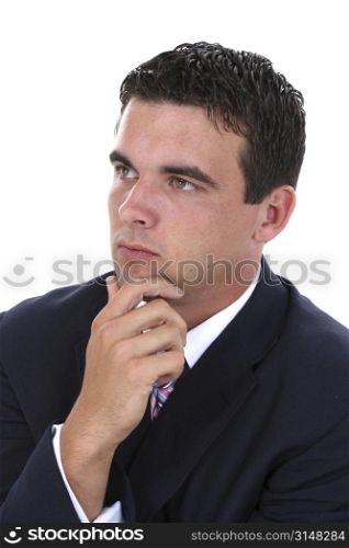 Attractive young businessman in suit (jacket & tie) thinking. Looking away from camera. Nice detail in face.