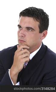 Attractive young businessman in suit (jacket & tie) thinking. Looking away from camera. Nice detail in face.