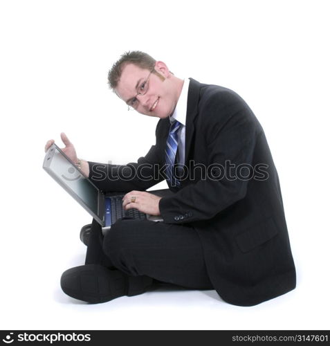 Attractive Young Businessman Sitting On Floor With Laptop.