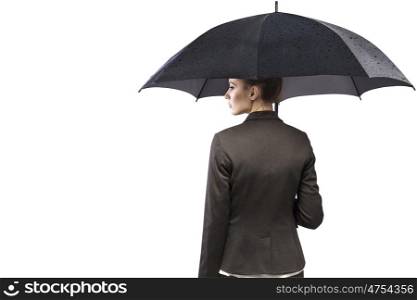Attractive young businesswoman holding an umbrella