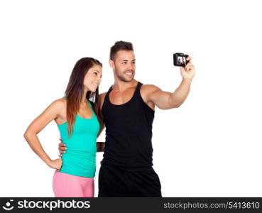 Attractive young couple by becoming a photo isolated on a white background
