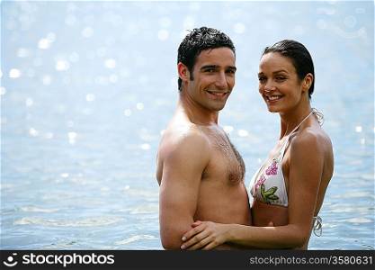 Attractive young couple in the sea
