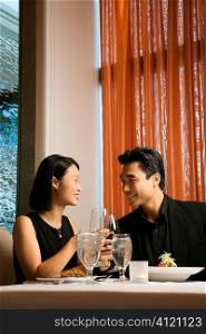 Attractive Young Couple Smiling at Each Other