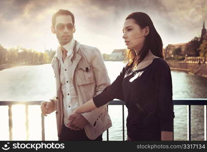 Attractive young couple wearing sunglasses