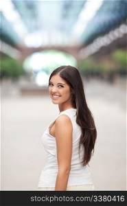 Attractive young female smiling while looking back