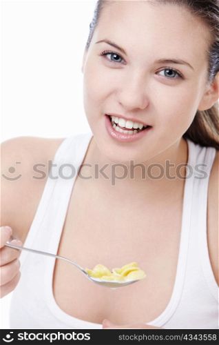 Attractive young girl with corn flakes