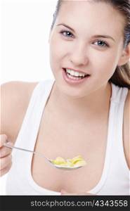 Attractive young girl with corn flakes