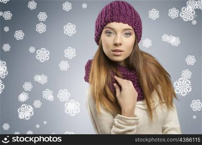 attractive young girl with fashion winter style and long smooth hair. She wearing wool purple hat, scarf and white sweater, looking in camera