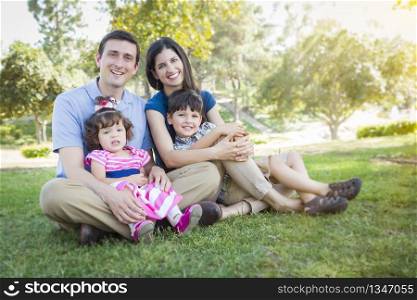 Attractive Young Mixed Race Family Portrait in the Park.