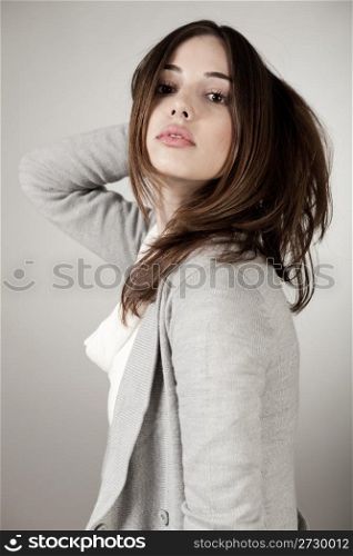 attractive young model side pose on light background
