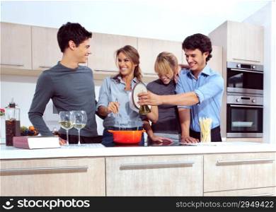 Attractive young people in the kitchen