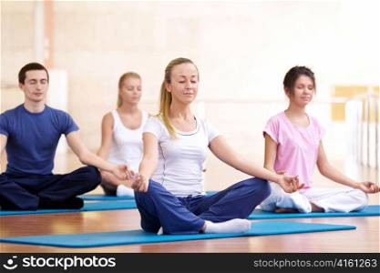 Attractive young people meditate
