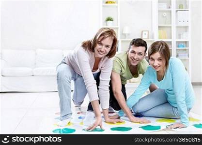 Attractive young people play Twister