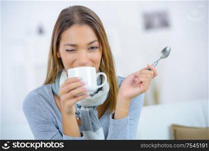 attractive young woman drinking coffee