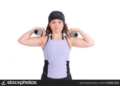Attractive young woman excercising with weights