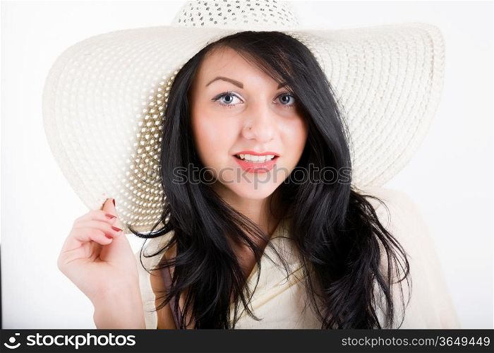 attractive young woman in a beach hat