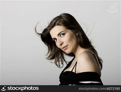 Attractive young woman in a studio