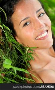 Attractive young woman in natural vegetation