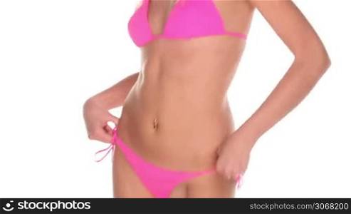 attractive young woman in pink bikini on blue screen