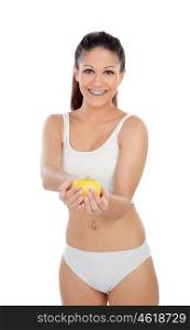 Attractive young woman in underwear with a apple isolated on a white background