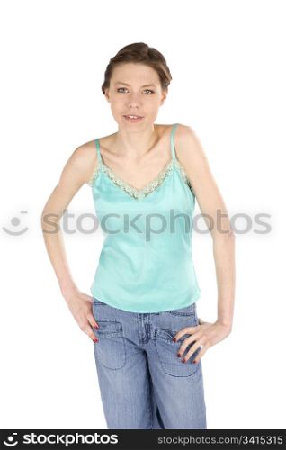 Attractive young woman standing with hands on hips, isolated on white background