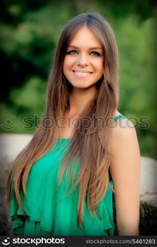 Attractive young woman with blue eyes posing outside