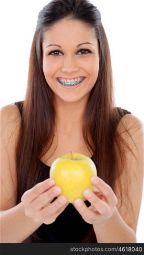 Attractive young woman with brackets eating a apple isolated on a white backgroung