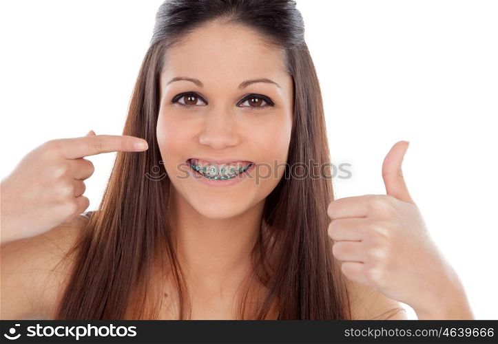 Attractive young woman with brackets saying Ok isolated on a white backgroung