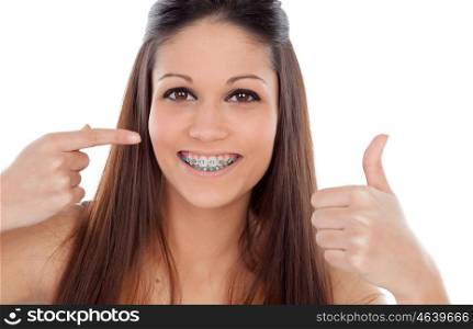 Attractive young woman with brackets saying Ok isolated on a white backgroung
