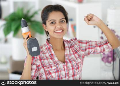 attractive young woman with drill