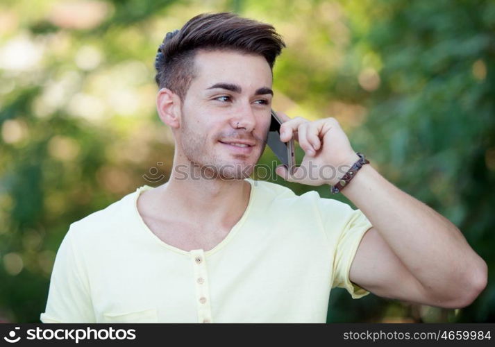 Attractive young woman with mobile in the park