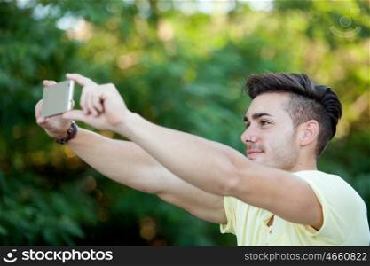 Attractive young woman with mobile in the park