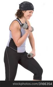 Attractive young woman working out with dumbels