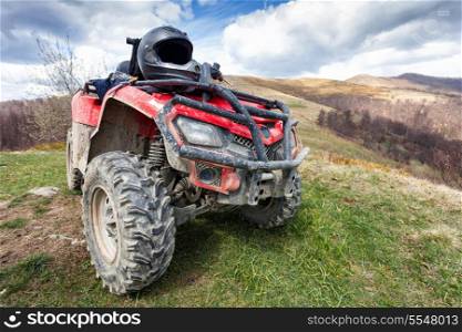 ATV on mountains landscape on a sunny day