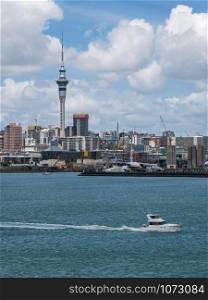 Auckland city skyline at city center and Auckland Sky Tower, the iconic landmark of Auckland, New Zealand.
