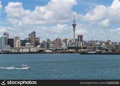 Auckland city skyline at city center and Auckland Sky Tower, the iconic landmark of Auckland, New Zealand.