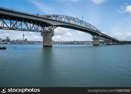 Auckland Harbour Bridge in Auckland, New Zealand, shot from Northcote using long exposure. The bridge joins St Marys Bay on the Auckland city side with Northcote on the North Shore side.