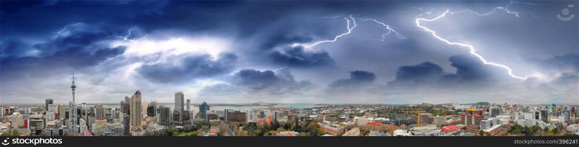 Auckland, New Zealand. Panoramic aerial view at sunset during a storm.