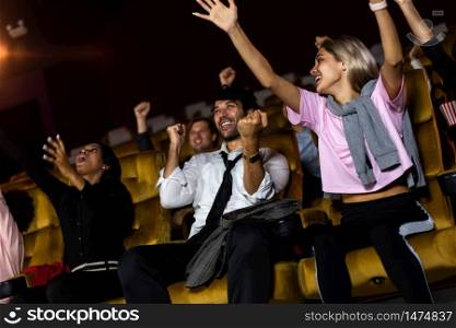Audience is happy and exciting in movie theater cinema. Group recreation activity and entertainment concept.
