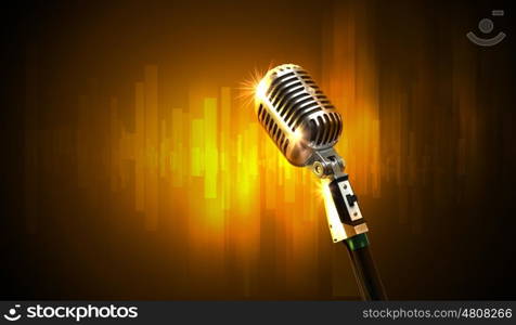 audio microphone retro style. Single retro microphone against colourful background with lights