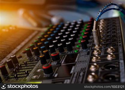 Audio sound mixer analog at the sound control room on blurred background