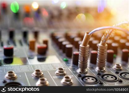 Audio sound mixer analog at the sound control room on blurred background